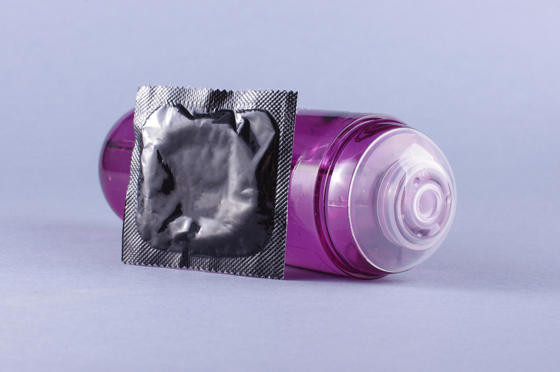 Unbranded condom & bottle of Lubricant gel