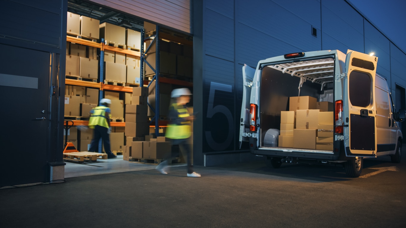 A van collecting products from a distribution warehouse.